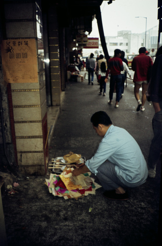 A man making offering on a street in Aberdeen
