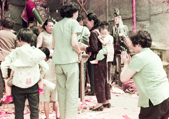 Woman and children worshiping gods