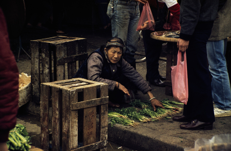 A lady hawker selling vegetables in Sheung Shui.