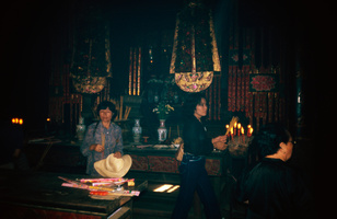 Woman worshiping in Kun Iam Tong Temple [Kwun Yum Temple] in Macau (Macao)